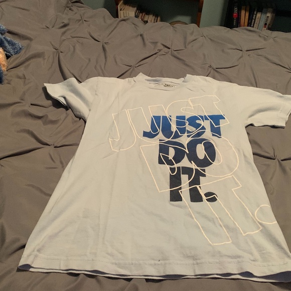 white and baby blue nike shirt